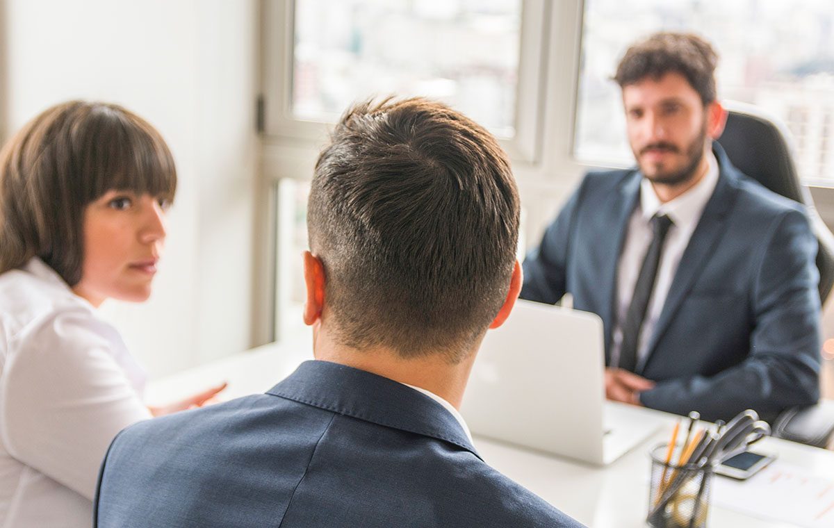 kare resimler_0002_businessman-businesswoman-sitting-front-manager-workplace